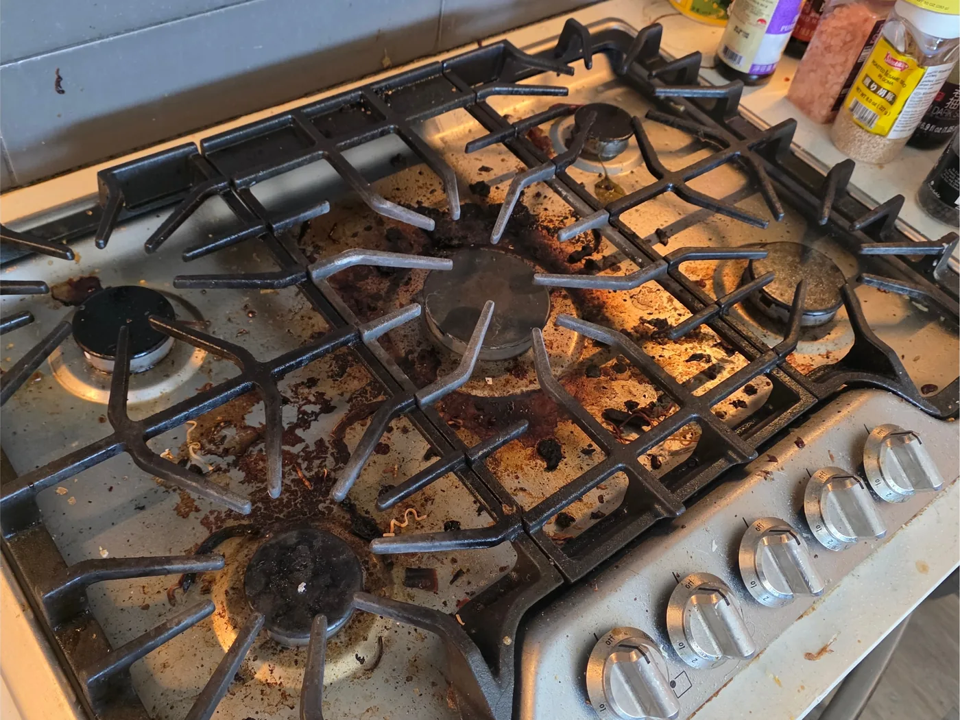 Gas stovetop before cleaning